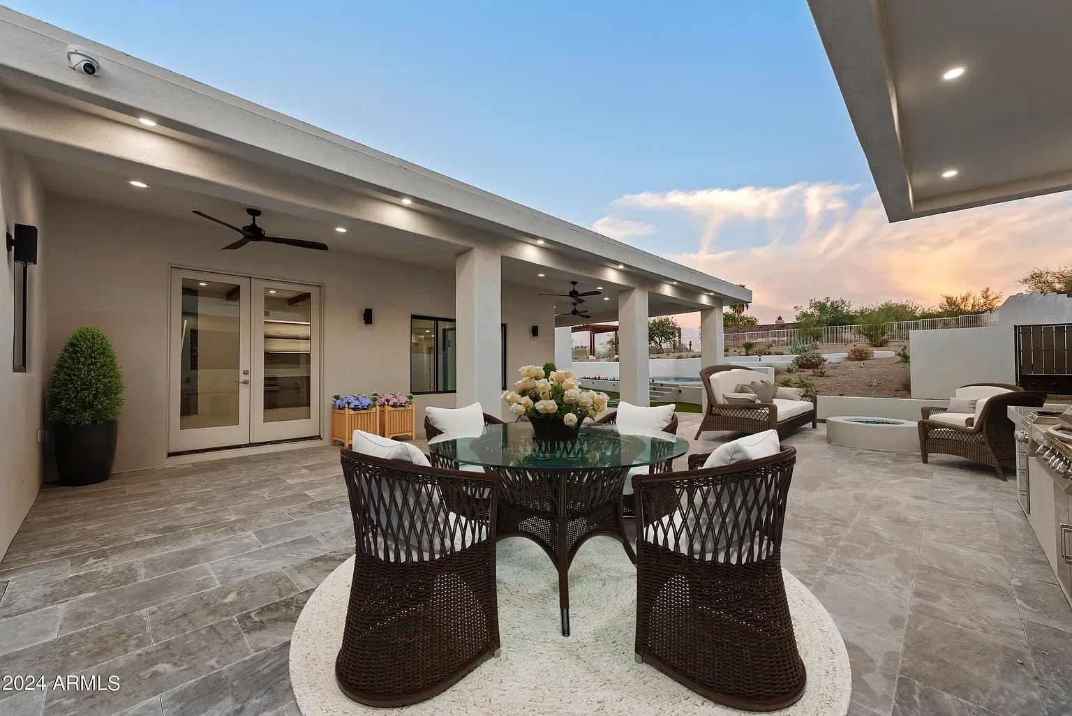 Covered Patio Dining: Tongue-and-groove patio ceiling with recessed cans and a fan rough-in. Framed, wired and finished on our own schedule.