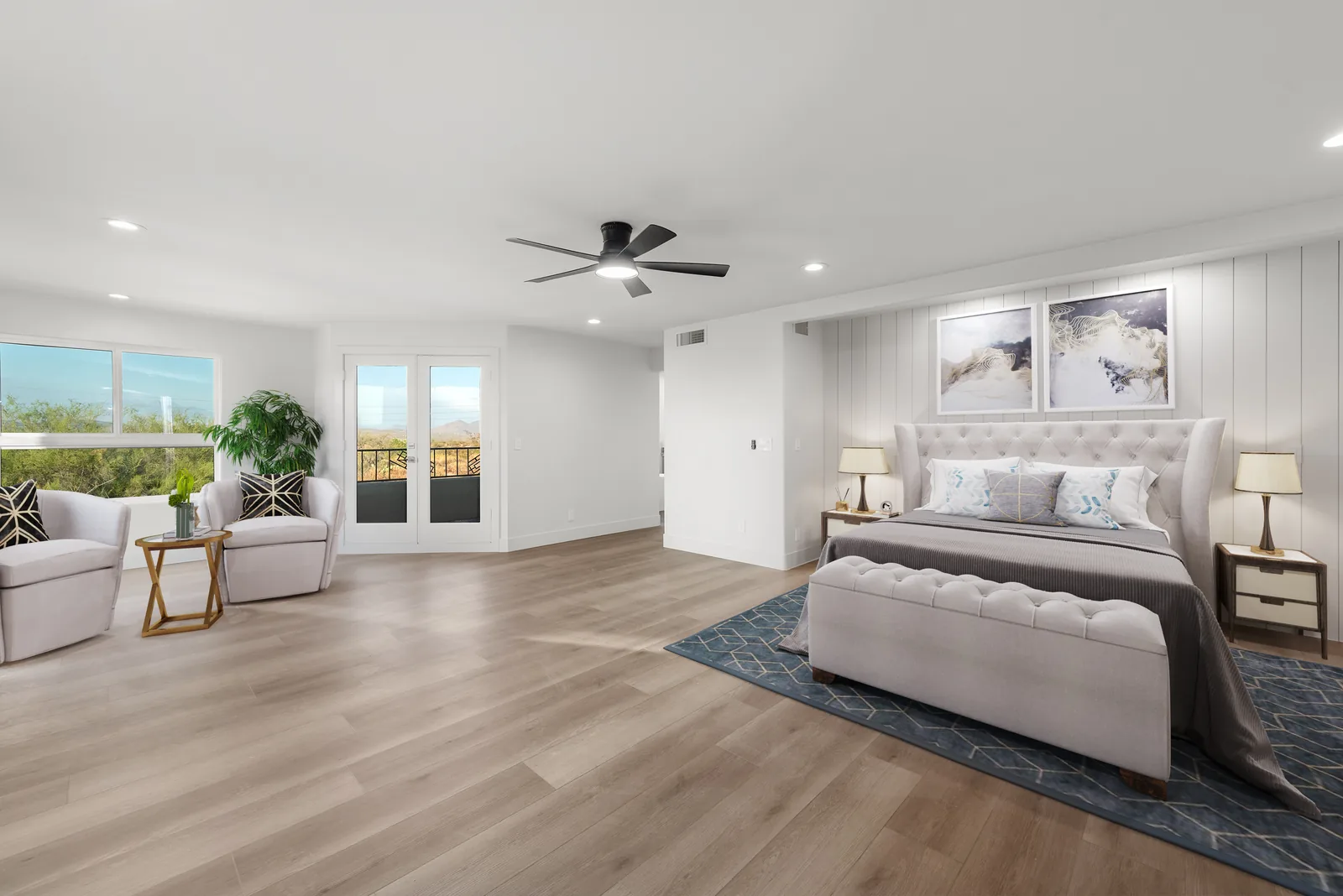 Primary Suite: Primary bedroom with a coffered ceiling detail, plank flooring and a direct patio slider.