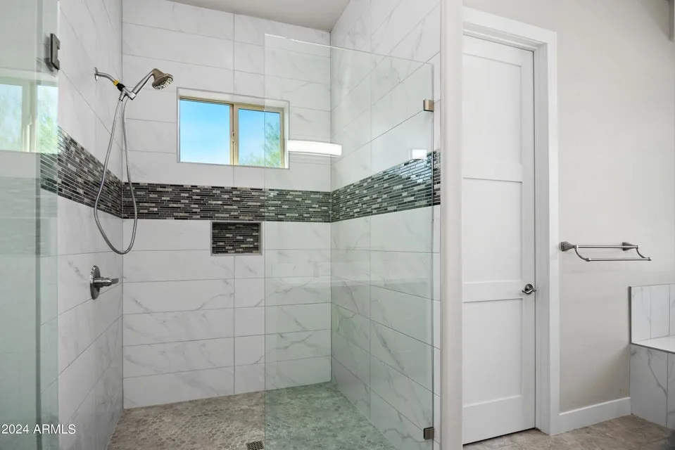 Tiled Shower & Niche: Full-height tile with a recessed niche and a linear mosaic band. Waterproofing and setting self-performed.
